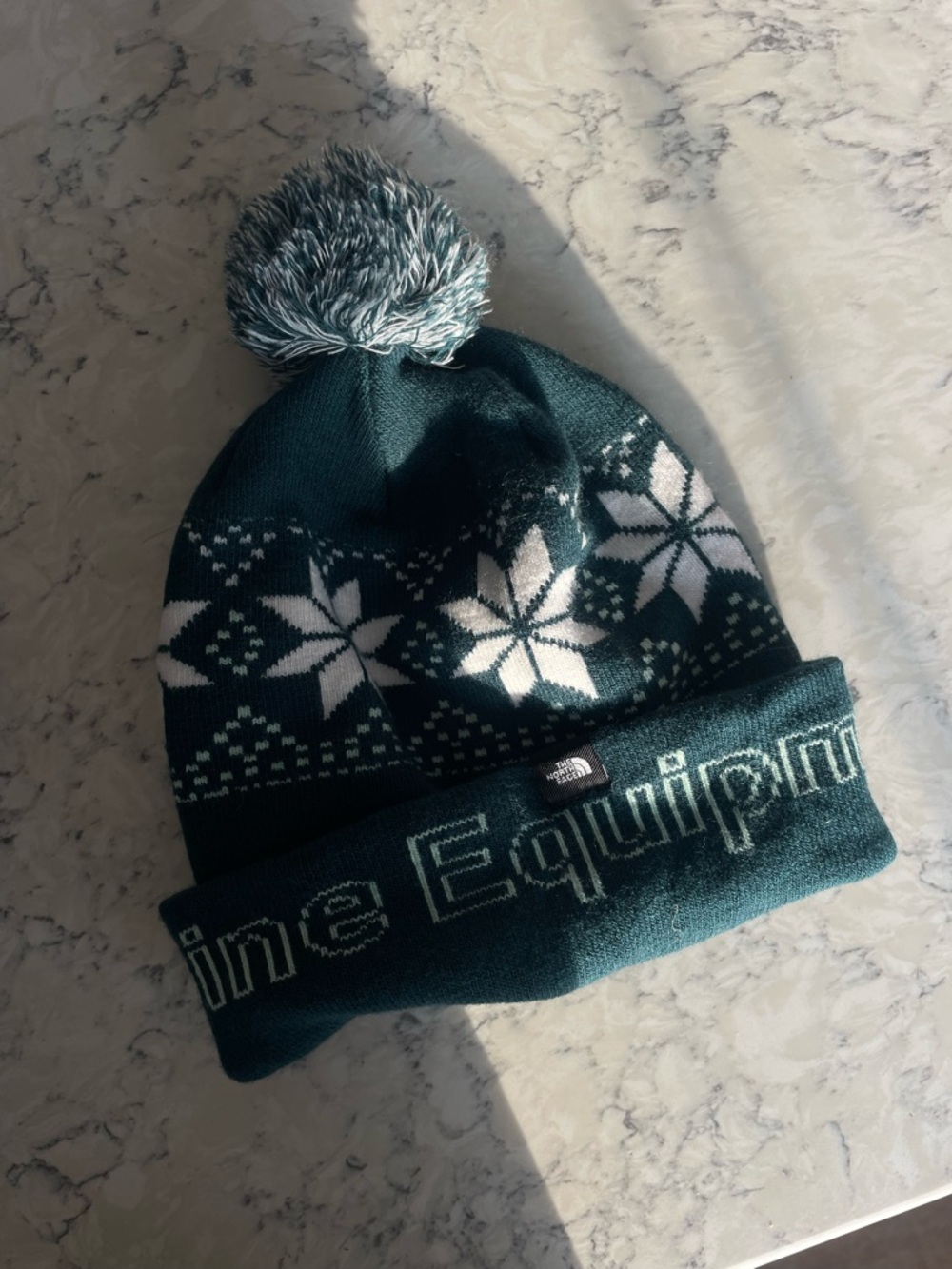 The North Face Dark Teal Pom Beanie with Snowflake Knit